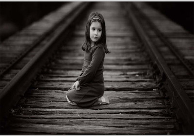 75% OFF on Small Girl On TrackPoster (18 x 12 Inches) by Shopkeeda Paper Print